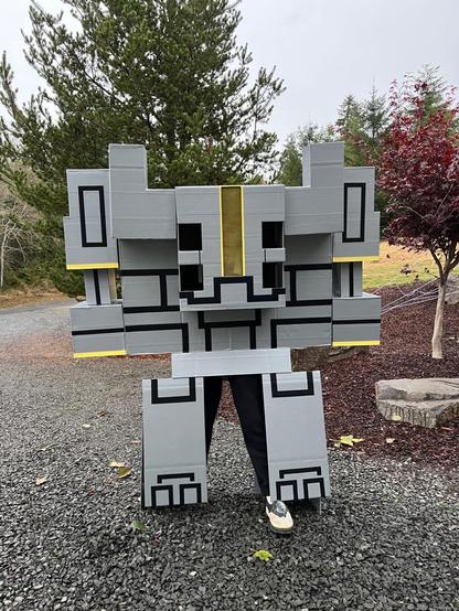 Gray and black with yellow trim Minecraft Monstrosity cardboard and duct tape costume.