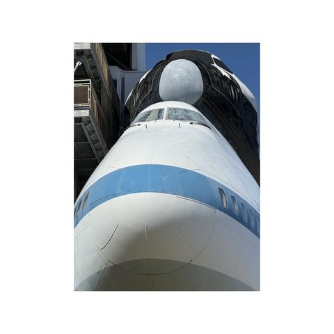 close up of noses of space shuttle above 747 transport