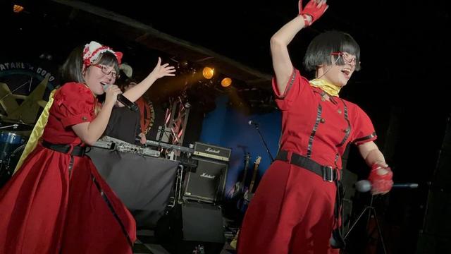 Menma and Chiyo in red Melon Batake uniforms.