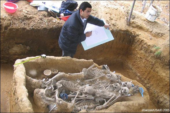 Excavation of the corpses of victims of the Guatemalan Civil War in Comalapa, Chimaltenango. Image shows human skeletons dug up from a mass grave. By This image is a work of a United States Agency for International Development employee, taken or made as part of that person&#039;s official duties. As a work of the U.S. federal government, the image is in the public domain in the United States.See also: The USAID privacy policy and the USAID Office of Inspector General &quot;Disclaimers &amp; Notices&quot; page - http://www.usaid.gov/gt/photos_democracy_governance.htm, Public Domain, https://commons.wikimedia.org/w/index.php?curid=10242131