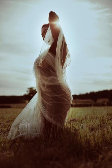Editorial photograph of a model on an open field