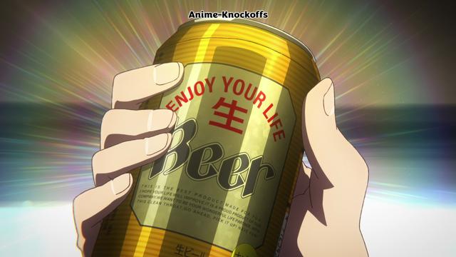 A golden beer can being held