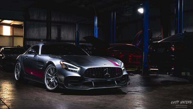 A Mercedes AMG GT-R in an automotive shop