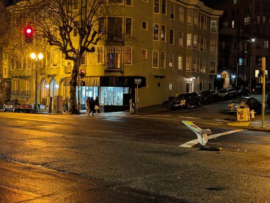 Photo of the intersection where Michael was hit with a crushed stop for pedestrian sign in the middle of the street