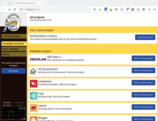 Screenshot of ArchiveTeam warrior web interface in a Firefox window.

Top right shows the logo: It has a hand drawn look. A black person carrying two white objects in their arms, runs away from three burning servers.

Main pane: 
All projects
What would you like to do?

Headline: Your current project
ArchiveTeam’s Choice
Your warrior will automatically work on the current ArchiveTeam project.
Button: Stop this project

Headline: Available projects
Each project has a blue button "Work on this project"
URLTeam 2, URL shorteners are a ticking timebomb.
US Government, Archiving the US Government. Short term project.
Livestream, Archiving Livestream. Short term project.
Clyp, Archiving Clyp. Short term project.
cohost, Archiving cohost. Short term project.

Left sidebar: Current project, Available projects, your settings, About, This warrior is working on a project. Shut down. 48.9 MB uploaded, 82.1 kB/s current upload speed, 204.9 MB downloaded, 1.9 MB/s current download speed. A graph showing down- and upload over the last few seconds.