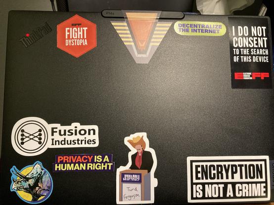 Laptop with stargate, eff, fftf, encryption and Turd Ferguson stickers