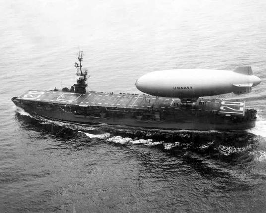 USS Mindoro CVE-120 with a K-class blimp from ZP-1 Squadron on deck, sometime in the first half of the 1950s.