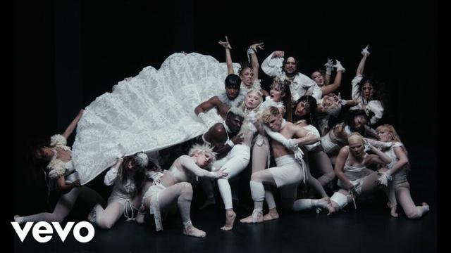 Abracadabra music video icon. Shot from the video showing a white-dressed Lady Gaga & her dancers dancing.