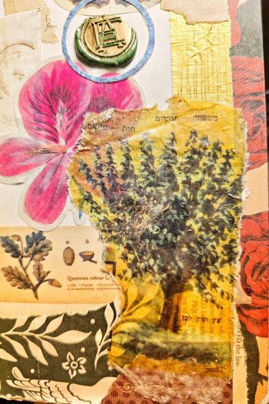 A hasty collage with a flower sticker, wrapping paper, washi tape, and candy wrapper, an old book page and an image transfer of a tree. At the top, there's a wax seal with the letters AE in monogram format.