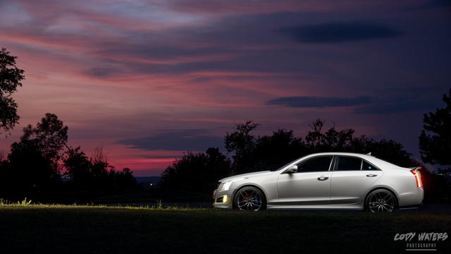 a 2013 Cadillac ATS at sunset