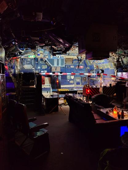 A construction site in a corner of c-base, brightly lit, looking like a space ship.