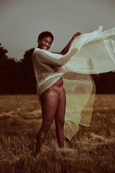 Editorial photograph of a model on an open field