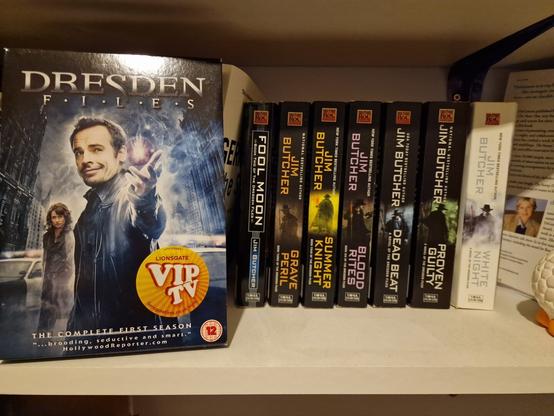 The DVD box of the Dresden Files, next to the books I have. I had the first book, but I lend it to my dad...