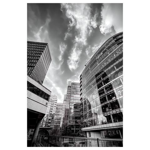 Black and white shot of London Wall with tall buildings and reflections on the glass windows