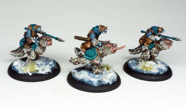 Three intricately painted mounted miniatures on snowy bases, featuring riders with vibrant armor and detailed sculpting, showcasing fantasy-style creatures.