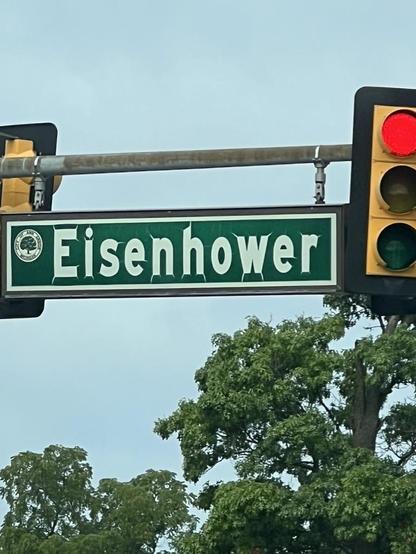 Weathered street sign for Eisenhower street.