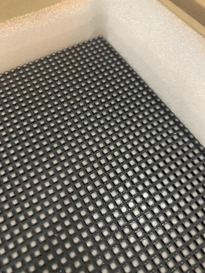 Close up of the LED matrix panel. The individual LEDs are visible. Some white foam is in the background around the panel.