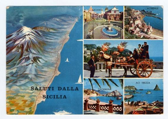 The image is a vintage postcard featuring six distinct photographs showcasing various scenic and cultural locations in Sicily, Italy. The top left shows the dramatic volcanic landscape of Etna with waves crashing along its coastline below. Adjacent to it on the right are two photos depicting urban scenes: one of Catania's historic architecture including an ornate church and a bustling city square, and another of Acireale by the sea.

In the center-right section is a vibrant photograph capturing traditional Sicilian culture, with individuals dressed in colorful costumes adorned with feathers near a cart filled with flowers. Below this cultural scene are two images: one showing Taormina's charming coastal town with its architecture and waterfront, and another featuring boat-filled harbors at Acitrezza.

The bottom left corner prominently displays the text "SALUTI DALLA SICILIA," which translates to "Greetings from Sicily." The overall composition is a colorful representation of Sicilian landmarks, cultural heritage, and natural beauty.