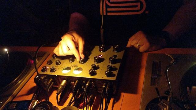rotary DJ mixer in use