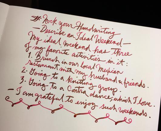 A description of my idea of a perfect weekend, hand written witha fountain pen, in cursive pink ink on a journal page. It lists: lunch with friends, going to a knitting group, and going dancing.