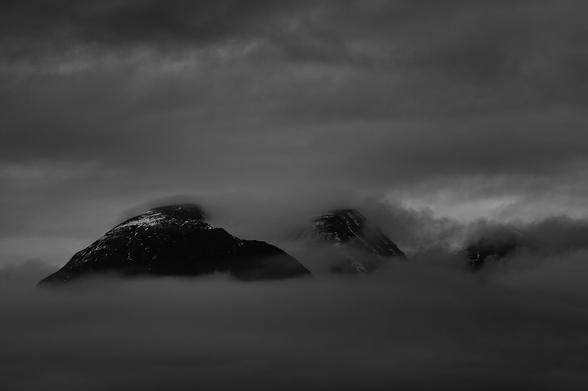 A mountain (Beinn Alligin) showing through the mist