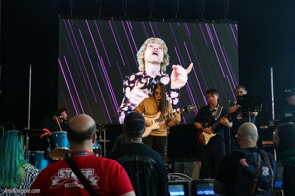 Baron Von Future plays in front of the audience while a pre recorded vocalist sings on stage