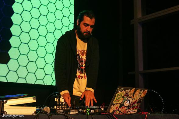 Shay aka Shady Monk plays music from the laptop
