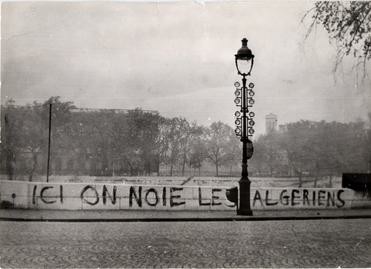 Graffiti on the Pont Saint-Michel in 1961: "Ici on noie les Algériens" ("Here we drown Algerians"). Dozens of bodies were later pulled from the River Seine. By Claude ANGELI et Jean TEXIER [first time published in the french journal L&#039;Humanité, 1985][1] - Archive of the l&#039;Humanité newspaper, Fair use, https://en.wikipedia.org/w/index.php?curid=37360836