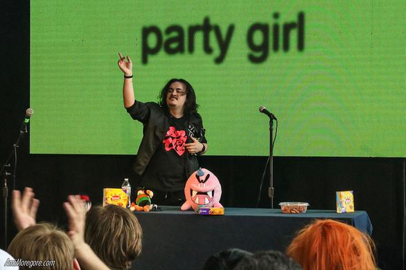 Pinkie Oats performs on stage