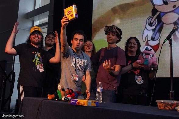 From left to right Knight of Games, Half Pixel, JoeBro (holding a totinos box), Heboyi, Minindo, Pinkie Oats gather together on stage