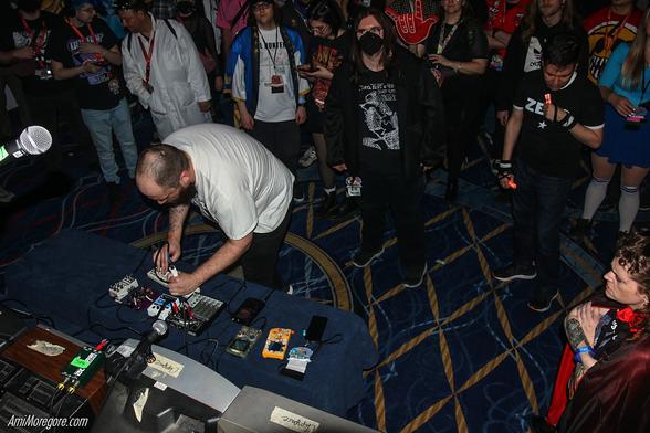 datacats performs in front of the stage with the crowd around them