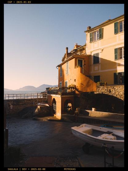 A picture of colourful Italian houses illuminated by the setting sun. Warm, sunny evening atmosphere.