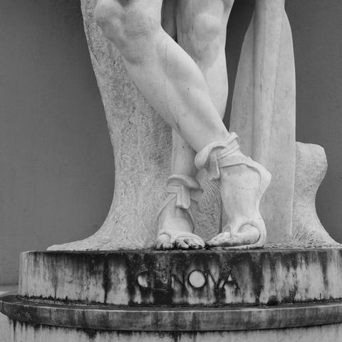 Legs of a monumental sculpture at the Foro Italico in Rome