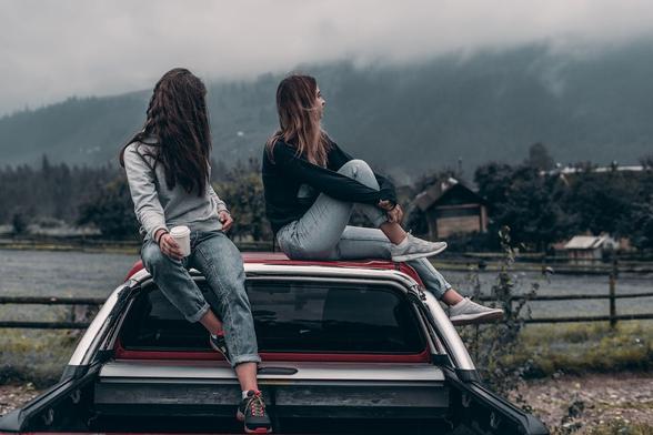 #Pexels #photo from #Broșteni #Suceava #Romania showing two young women with long hair and wearing jeans, sitting on top of a pickup truck cabin. From behind we only see part of the pickup truck, which is at least partly colored in bold red. The two figures are looking away from the camera. Beyond the truck is a rustic wooden fence, and what looks like a river on the other side of the fence. There are trees and building structures on the other side of the river. 

Dated 2018 Aug 16, by 
Elijah O'Donnell. 
www.Pexels.com/photo/two-women-sitting-on-vehicle-roofs-2409681/ 

www.KronoMoon.org 🏳️‍🌈 ☮️ 
#KronoWatch
