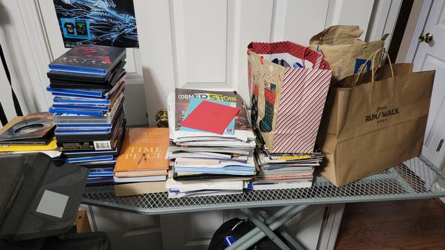 Organized piles of "staff" on an Ironing Board frame.