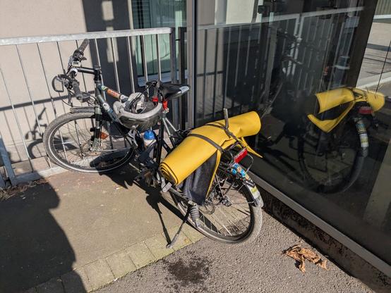@000panther A bicycle is parked by a metal fence. The bicycle has a helmet on it. The bicycle is parked on a concrete surface. The bicycle has a yellow yoga mat attached to the back. There is sweat dripping from both ends of the yoga mat

Provided by @altbot, generated using Gemini