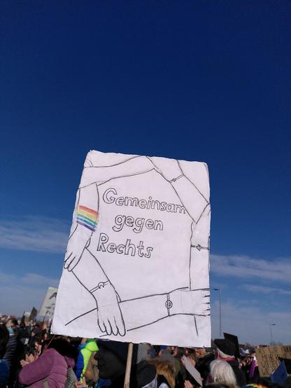 Schild: Fünf Miteinander verschränkte Arme, in der Mitte "Gemeinsam gegen Rechts"