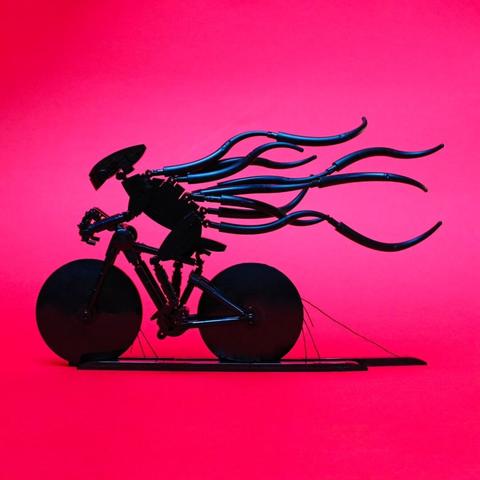 a model of a bicycle rider made of Lego bricks