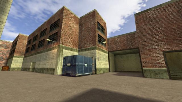 In this picture you can see the Alleyway again, from the previous photo series. You can see from right to left an entrance with a staircase leading to the upper and to Trainyard A &amp; B. To the left is another and larger entrance, which leads to Trainyard B. To the left of the second entrance is a blue Conatiner in a corner, which has two lamps. Further down the alleyway you can see an entrance and a wooden box. This is on the map de_train in the game Counter-Strike 1.6.