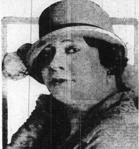 Camille Cohen Jones in the 1920s; a Black woman with light skin, wearing a brimmed hat low over her brow, and a fur wrap