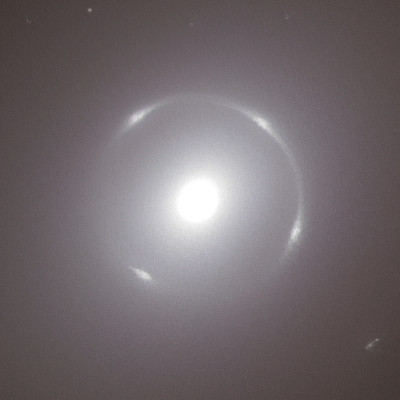 Image of the Einstein Ring gravitational lens in the center of NGC 6505. The ring is the bent image of the background galaxy, the central bright spot is the center of NGC 6505 itself.