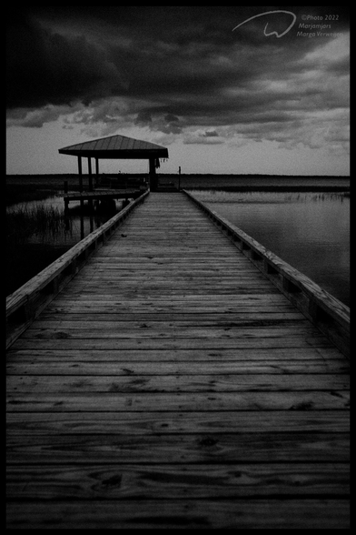 A boathouse at the end of a pier somewhere in the Everglades, Florida, before a storm hits.