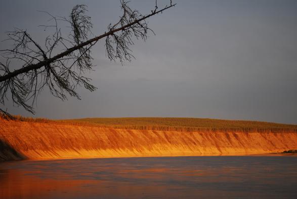 A view of the Ulakhan Sular exposure in the background at sunset.