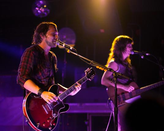 Brian Aubert and Nikki Monninger of Silversun Pickups playing guitar and bass respectively in 2013.