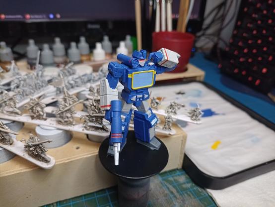 Partially painted Soundwave transformers miniature. left side view