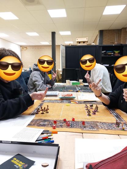 Foto af four school nerds set across two blood bowl 7 pitches all pointing their middle finger at the camera to tell you what a f****** s*** game this is. All their faces have been blotted out with cool smileys