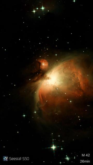 A vibrant image of the Orion Nebula (M42), showcasing colorful gases and numerous stars against a dark cosmic background. The image includes the notation "Seestar S50" and indicates a 26-minute exposure time.

Żywy obraz Mgławicy Oriona (M42), prezentujący kolorowe gazy i liczne gwiazdy na ciemnym kosmicznym tle. Obraz zawiera notację "Seestar S50" i wskazuje 26-minutowy czas ekspozycji.