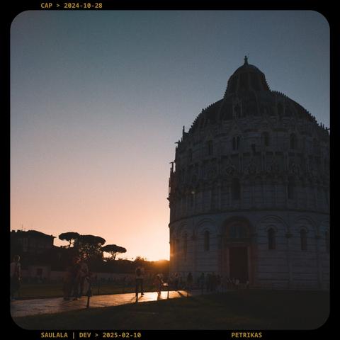A photo of a sunset behind the Baptistry of St. John in Pisa, Italia.