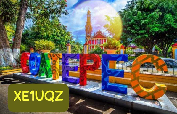 XE1UQZ Victor’s colorful QSL card from Coatepec, featuring some local architecture, a giant moon in the background, and tree-lined landscaping that make it look like the place-name is an exhibit in a fancy public park.