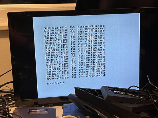 A Sinclair Spectrum screen showing a looping text which says “Subscribe to re:enthused”